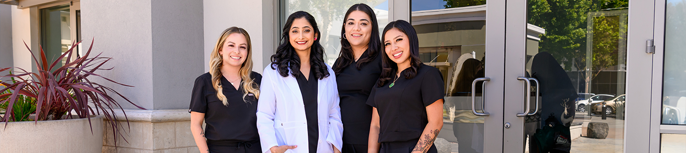 Fremont dentist Dr. Veechika Gaddam with dental team