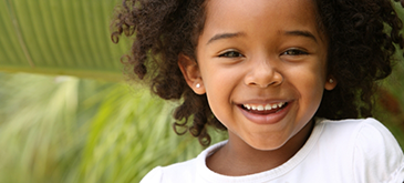 Close up of young child smiling