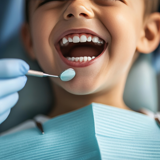 Little boy opening mouth for dental mirror